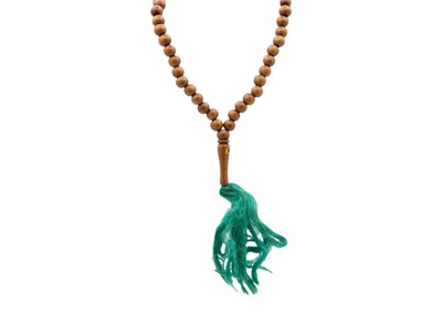 Lot 47 - A string of wooden Mala prayer beads.