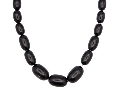 Lot 57 - A black plastic bead necklace.