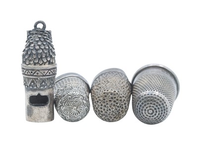 Lot 13 - A novelty owl whistle, together with three silver thimbles.