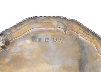Lot 8 - A George II silver waiter by John Cafe.