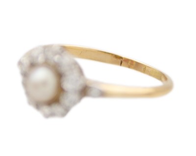 Lot 17 - A high purity gold pearl and diamond cluster ring.