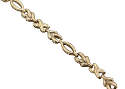 Lot 15 - A 9k gold hollow knot-style link bracelet with a safety chain.