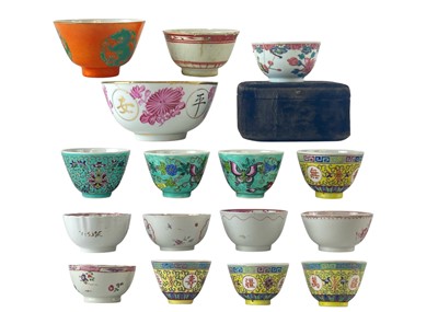 Lot 716 - A Chinese coral ground tea bowl.