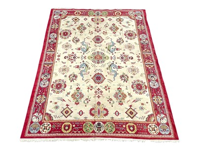 Lot 623 - A Persian carpet.