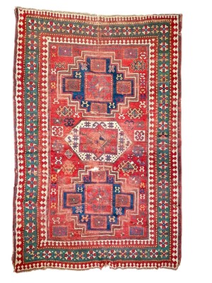 Lot 640 - A Kazak carpet.