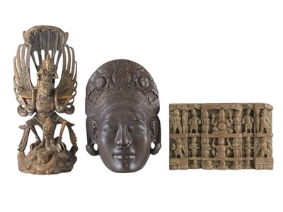 Lot 670 - A Balinese carved hardwood face mask.