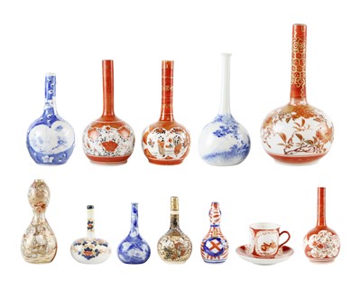 Lot 773 - A pair of Japanese Imari small bottle vases.