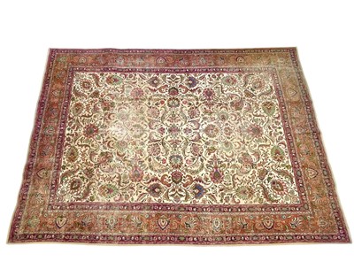 Lot 605 - A Tabriz carpet.