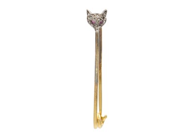 Lot 47 - A high purity gold fox head diamond and ruby set pin.