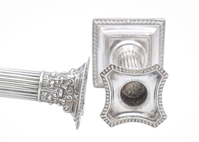 Lot 17 - A pair of Edward VII silver Corinthian candlesticks by Henry Matthews.