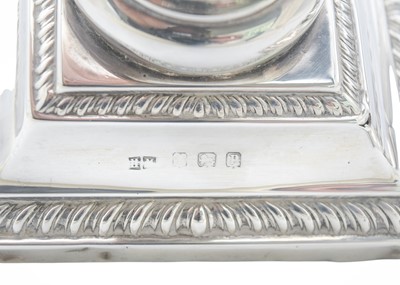 Lot 17 - A pair of Edward VII silver Corinthian candlesticks by Henry Matthews.