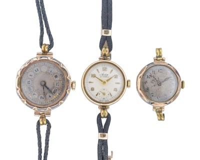 Lot 1182 - A selection of three 9k gold ladies' wristwatches.