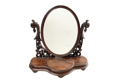 Lot 534 - A Victorian mahogany oval swing dressing table mirror.