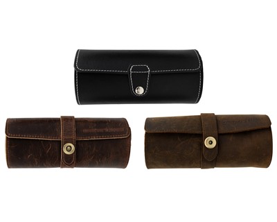 Lot 1153 - A selection of three leather covered wristwatch roll cases.