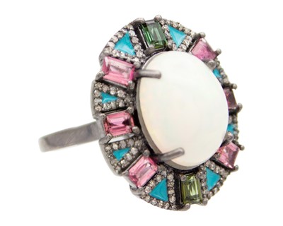 Lot 102 - A silver opal, tourmaline, and diamond set dress ring.