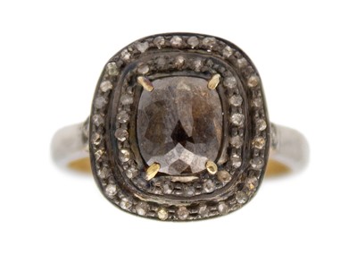 Lot 117 - A silver gilt brown diamond halo ring.