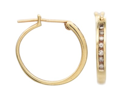 Lot 106 - A pair of 10k diamond set hoop earrings.