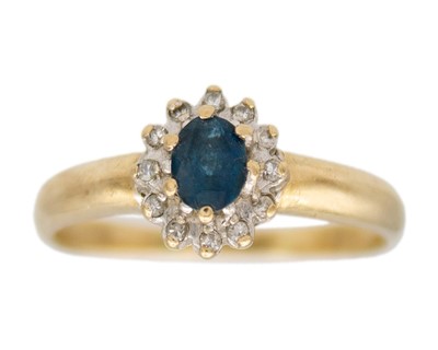 Lot 109 - A 9k blue topaz and diamond set cluster ring.