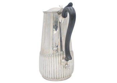 Lot 25 - A George V silver half-fluted hot water pot by Manoah Rhodes & Sons Ltd.