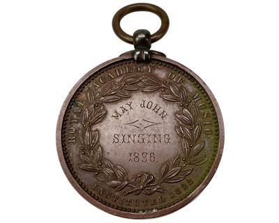 Lot 4 - A Royal Academy of Music bronze medal awarded to May John, 1896.
