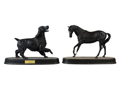 Lot 365 - A Beswick matt black figure of a spaniel.