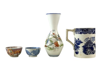 Lot 356 - A John Tams Crown Pottery blue and white willow pattern Quart measure.