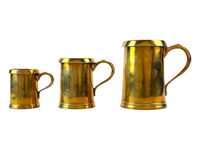 Lot 77 - A set of three Farrow and Jackson bronze measures.
