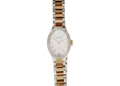 Lot 1058 - BULOVA - A lady's stainless steel quartz bracelet wristwatch with diamond set bezel.