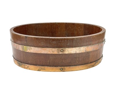 Lot 496 - A late Victorian brass bound oval teak jardiniere.