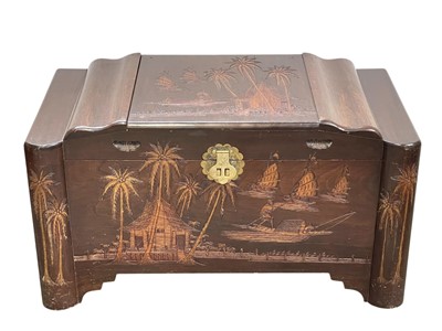 Lot 524 - A Chinese carved camphor wood chest.