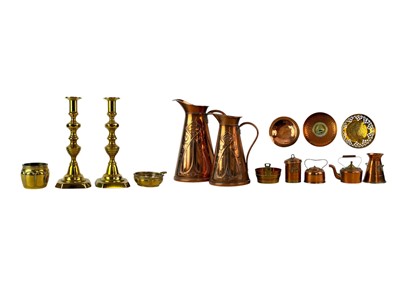 Lot 80 - Two Joseph Sankey and Sons graduated copper jugs.