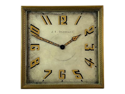 Lot 465 - A French Art Deco brass cased square easel timepiece.