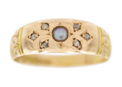 Lot 59 - A Victorian 15k gold split pearl and diamond set band ring.