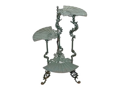 Lot 101 - A late 19th/early 20th century cast iron three tier fan design plant stand.