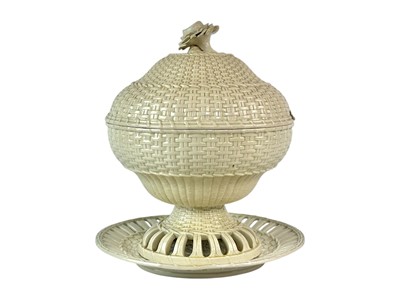 Lot 322 - An 18th century creamware chestnut bowl and cover with stand.