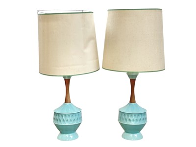 Lot 427 - A pair of turquoise glazed ceramic table lamps.