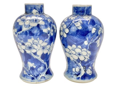Lot 647 - A pair of Chinese prunus pattern vases.