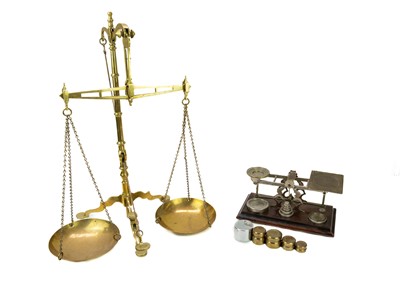 Lot 79 - A set of brass banker's scales by Doyle & Son, Borough, London.