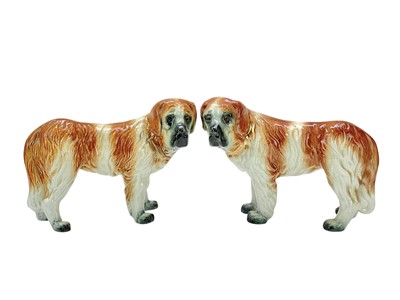 Lot 363 - A pair of Staffordshire pottery figures of St Bernard dogs.