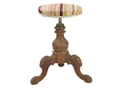 Lot 504 - A Victorian walnut adjustable piano stool.