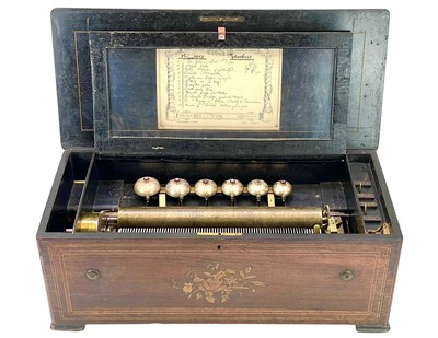 Lot 5 - A Swiss rosewood, inlaid, and ebonised cylinder music box.