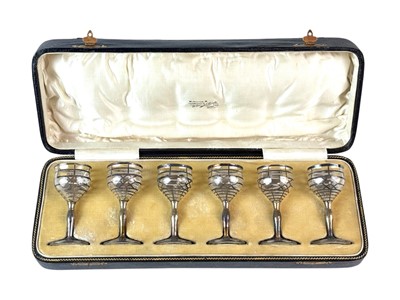 Lot 460a - A cased set of six silver overlay liquor glasses.