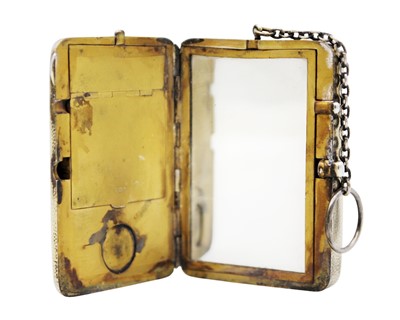 Lot 211 - An Edwardian silver gilt combination compact purse by Cohen & Charles.