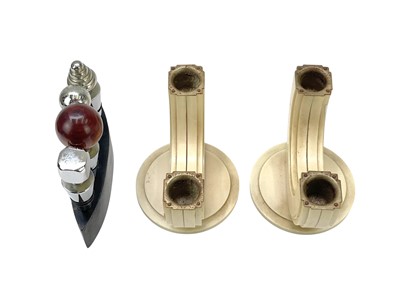 Lot 30 - A pair of Art Deco Bakelite twin branch candelabra.