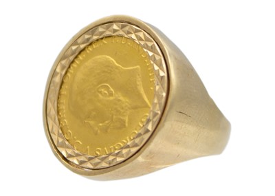 Lot 88 - A half sovereign 9k gold ring .