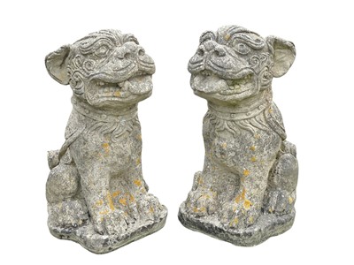 Lot 382 - A pair of reconstituted stone Foo Dog dog garden sculptures.