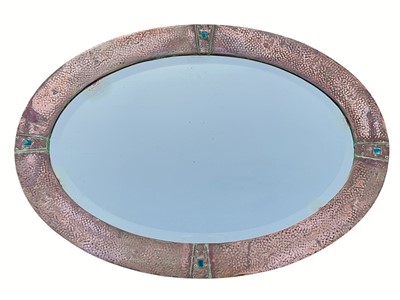Lot 840b - An Arts and Crafts oval copper mirror.