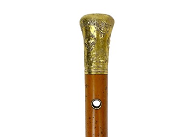 Lot 105 - An 18th-century, high-purity gold mounted malacca walking cane.