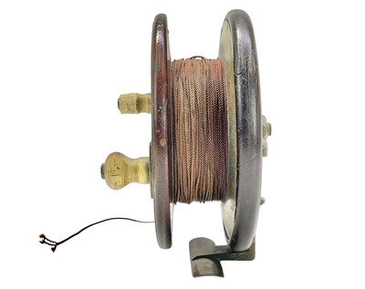 Lot 14 - A Brass and mahogany sea fishing reel.