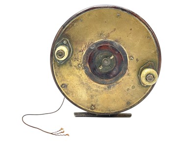 Lot 14 - A Brass and mahogany sea fishing reel.